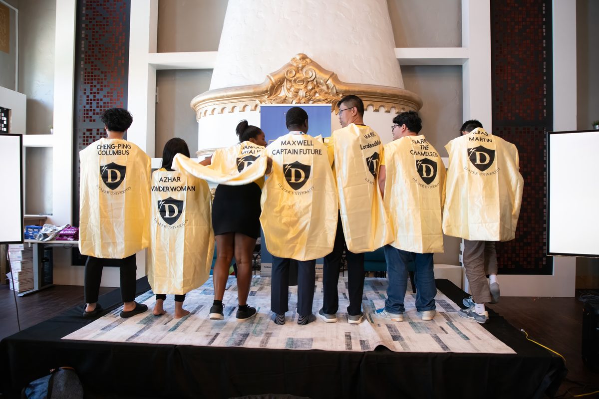 Team Lightning at Draper University, Silicon Valley — Maxwell's cape reads 'Captain Future'